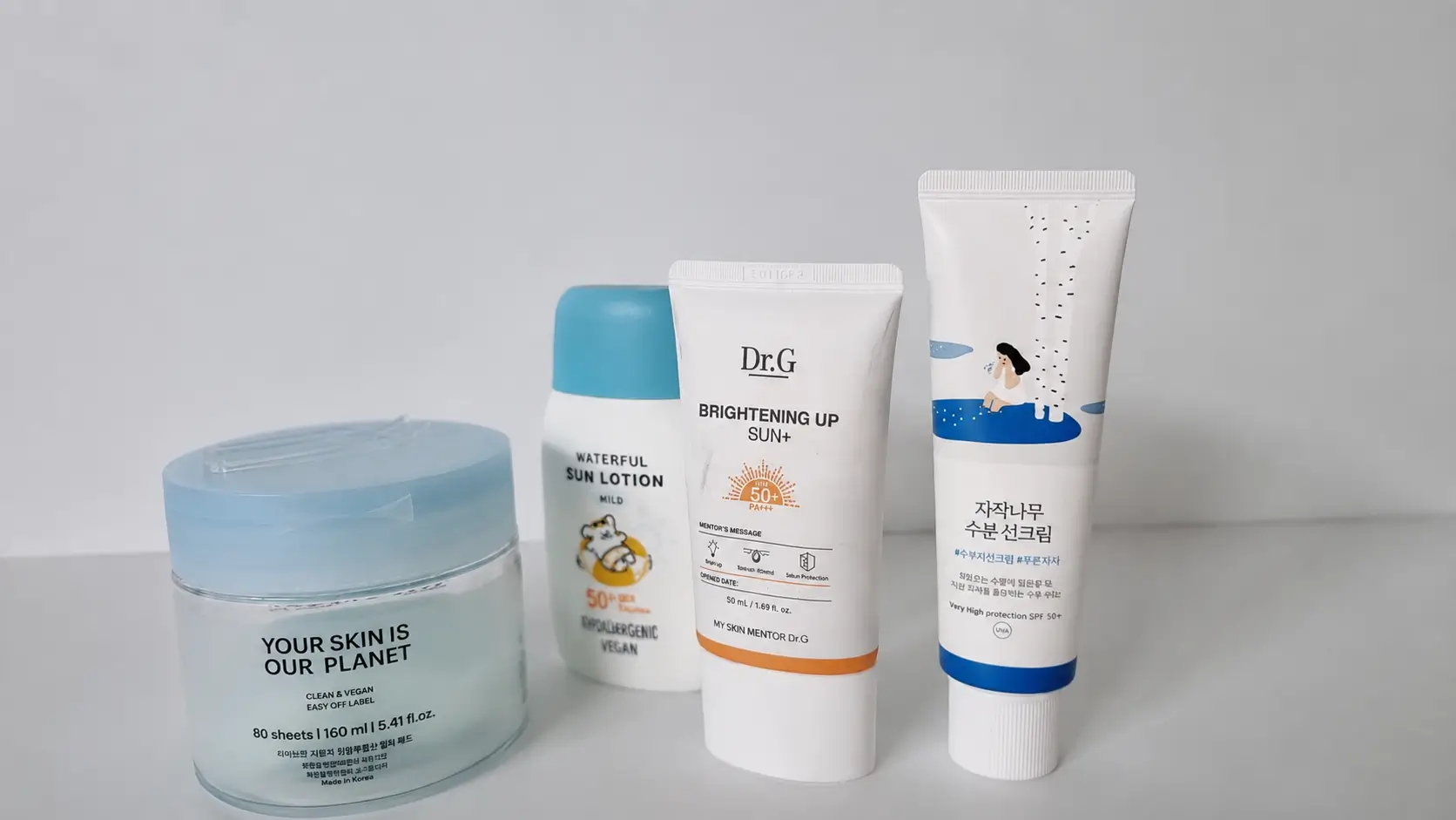 Dr.G Brightening Up Sun Plus and Goongbe Waterfull Sun Lotion used in a simple Korean skincare routine for women over 50.